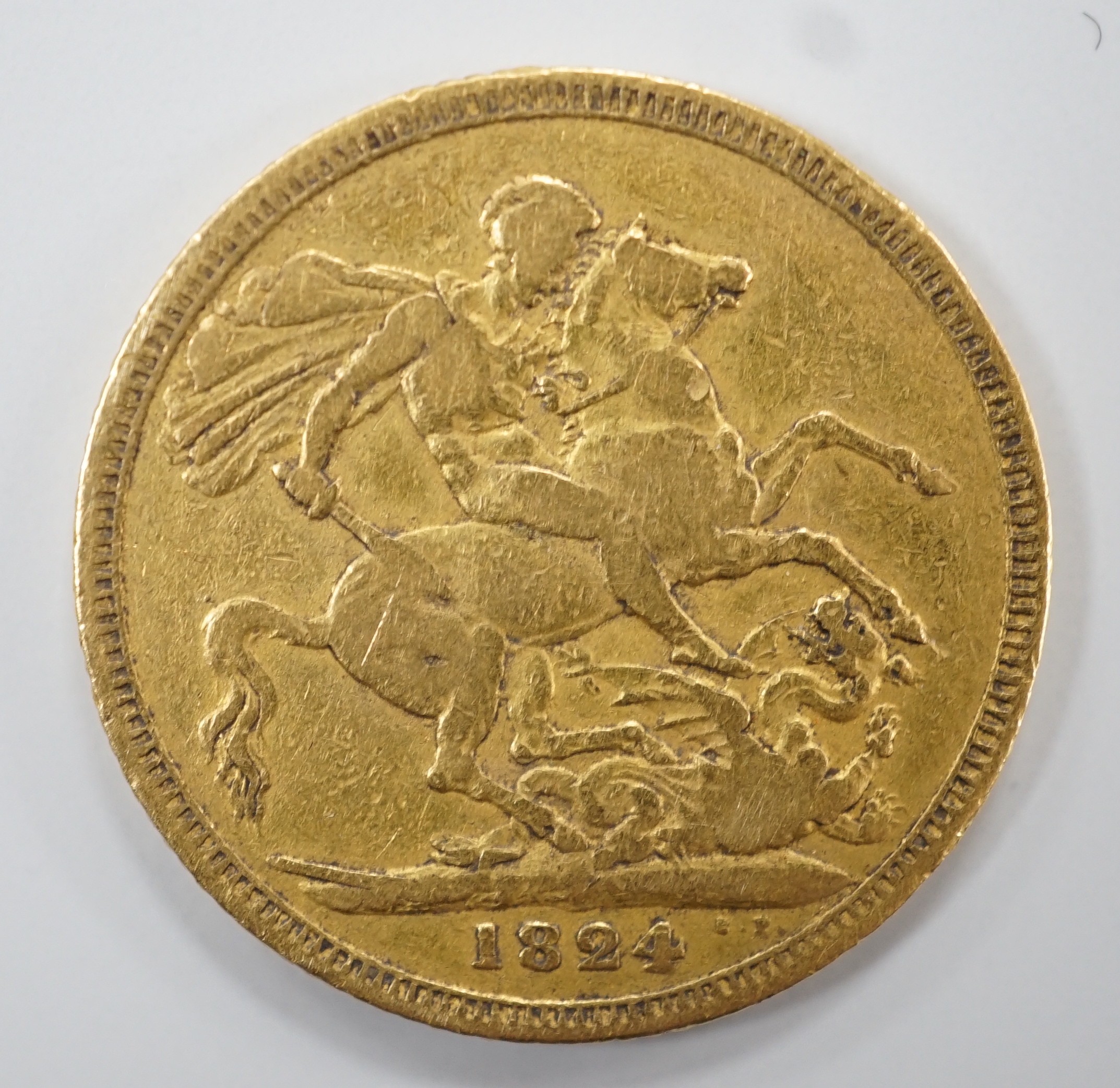 A George IV 1824 gold sovereign, VG or better.